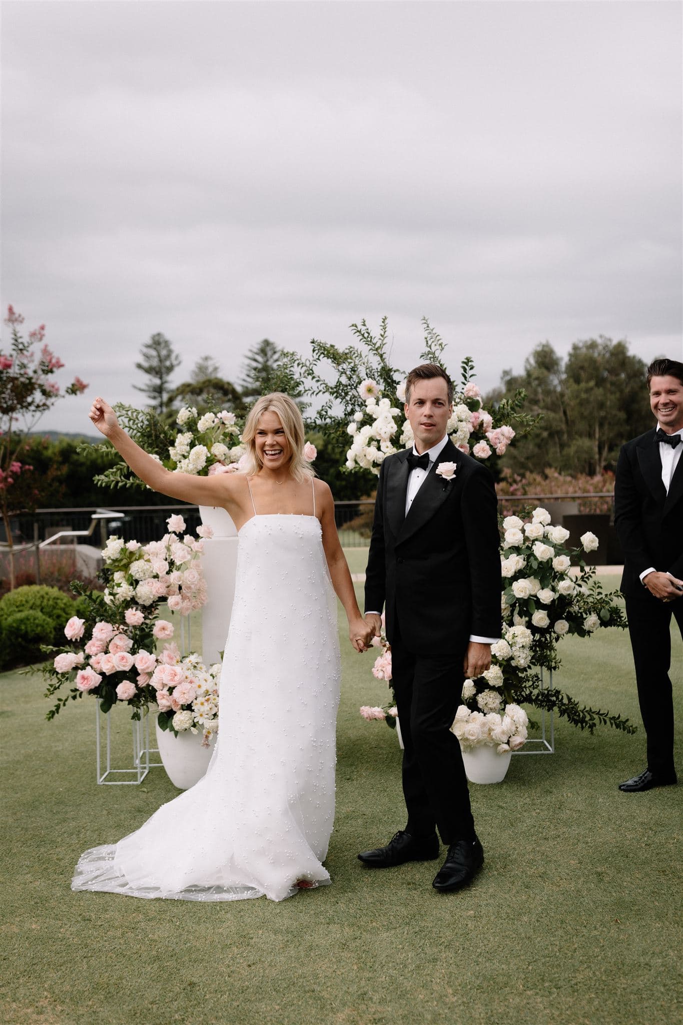 Pink floral arch wedding